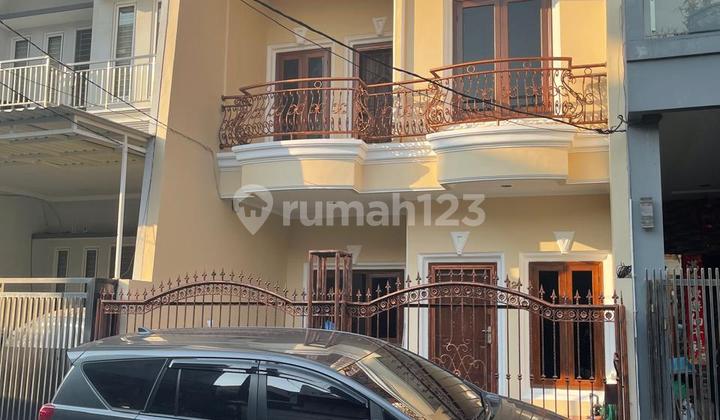 Rumah 2 Lantai 6X15 Rapi Taman Surya 3 - foto 1