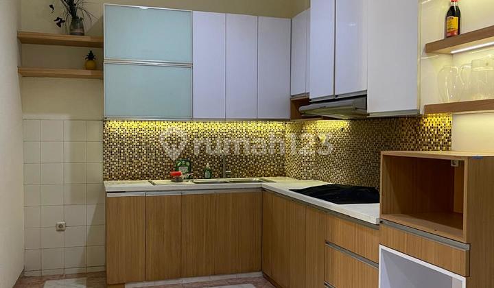 Rumah Taman Surya 2 Lantai SHM Lingkungan Asri - foto 1